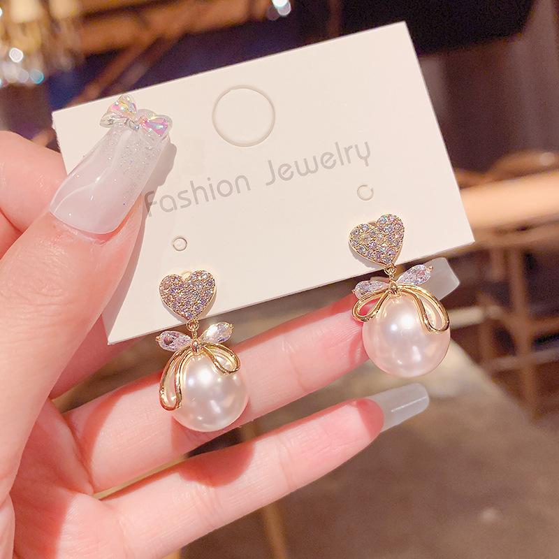 Korean Minimalist Pearl Bow Studs – Hypoallergenic Elegance for Women
