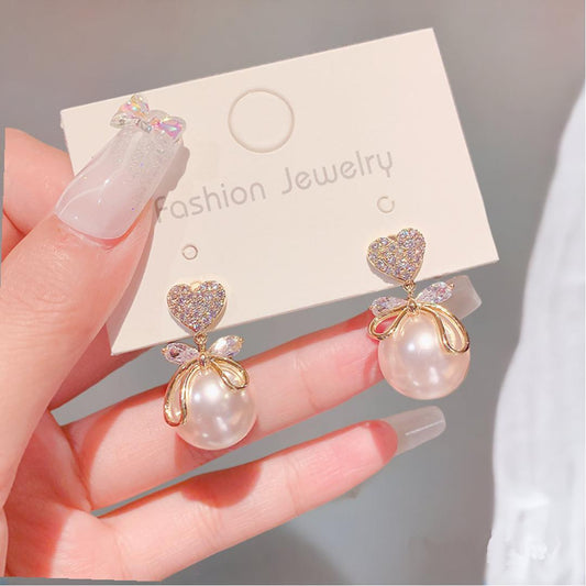 Korean Minimalist Pearl Bow Studs – Hypoallergenic Elegance for Women